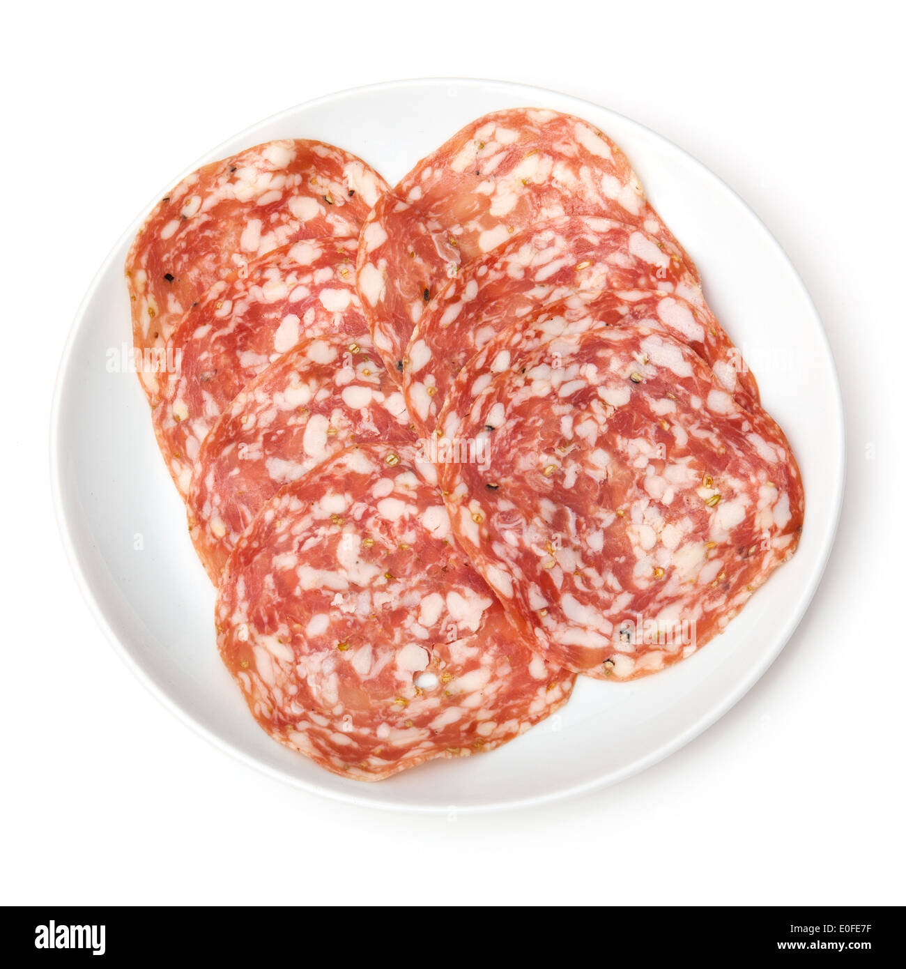 Plate of Salame Finocchiona pork salami with fennel seeds isolated on