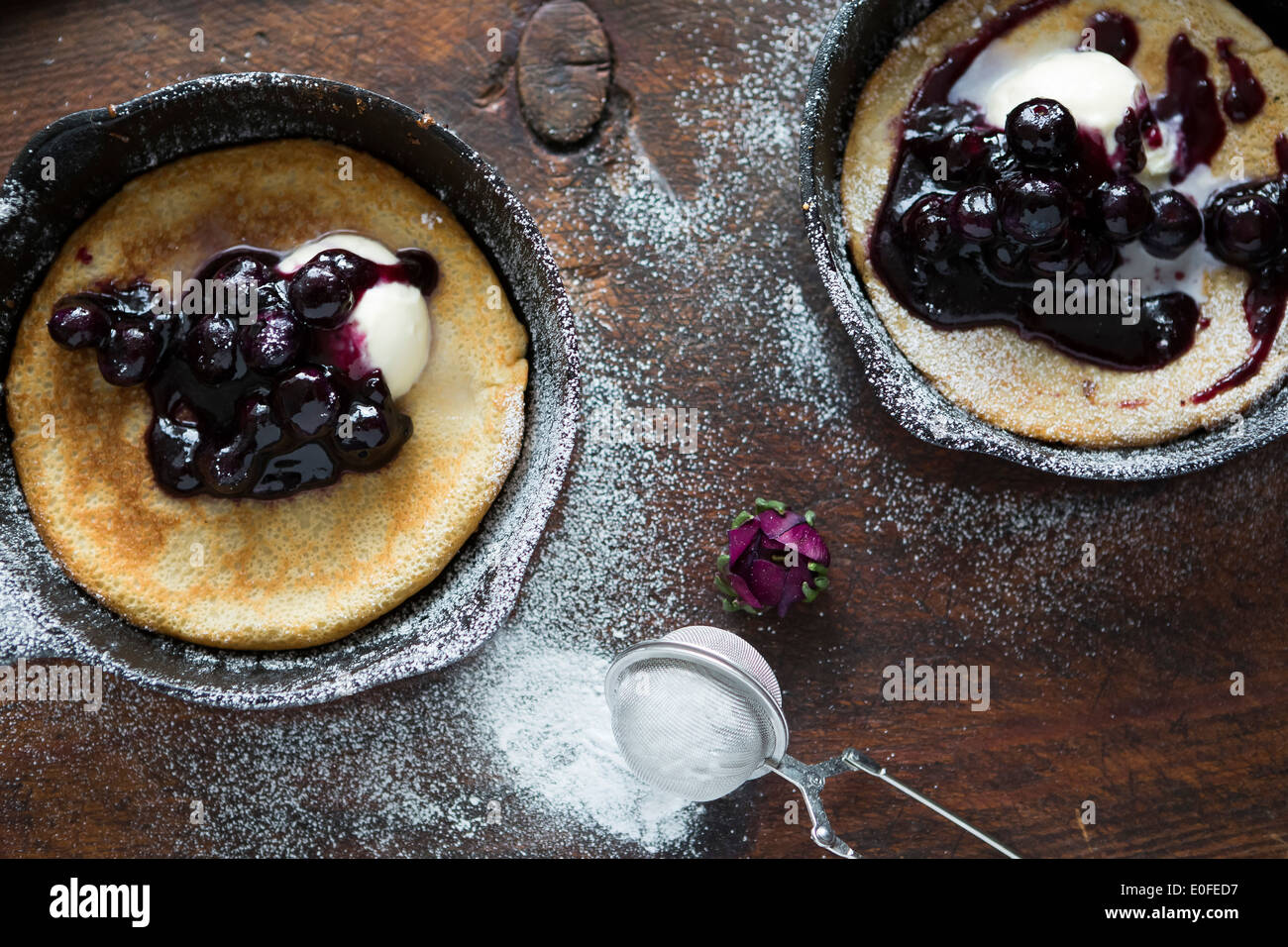 Blueberry and Mascarpone Pancakes in Skillets Stock Photo