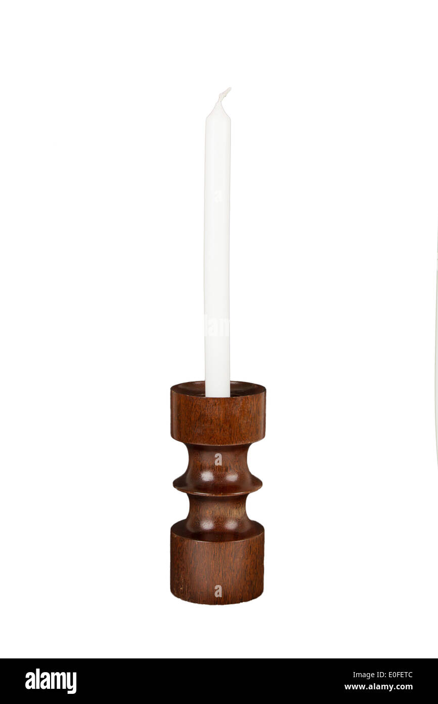 Old antique wooden candlestick candleholder with vintage candle isolated on white Stock Photo