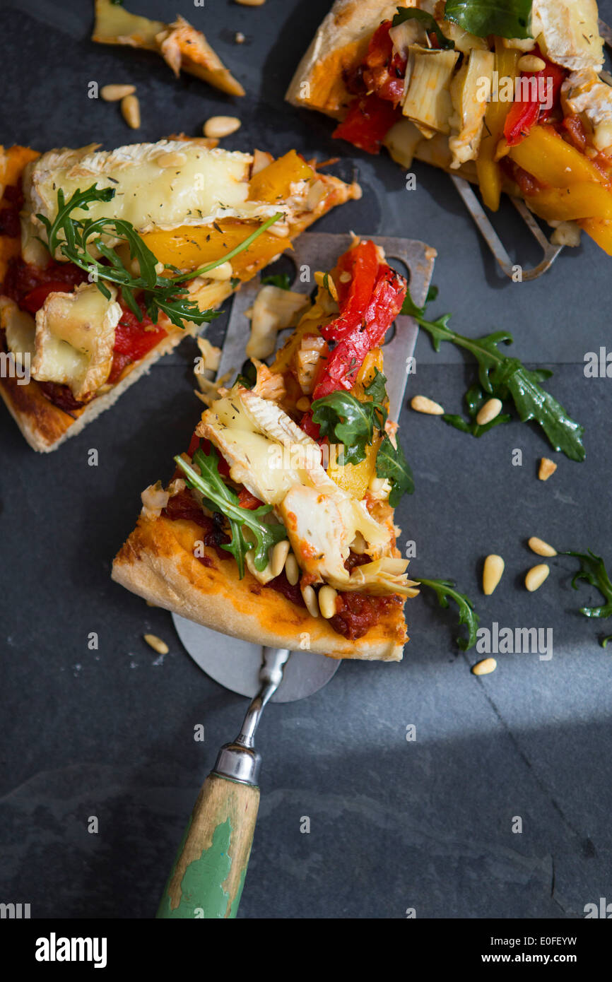 Homemade Vegetarian Pizza with Peppers, Brie & Rocket Stock Photo