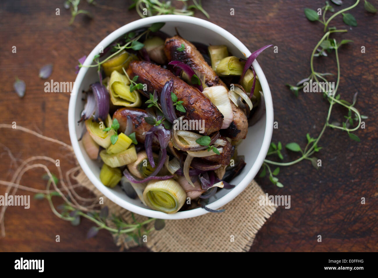 Sausage, Leek, Red Onion & Thyme in a bowl Stock Photo