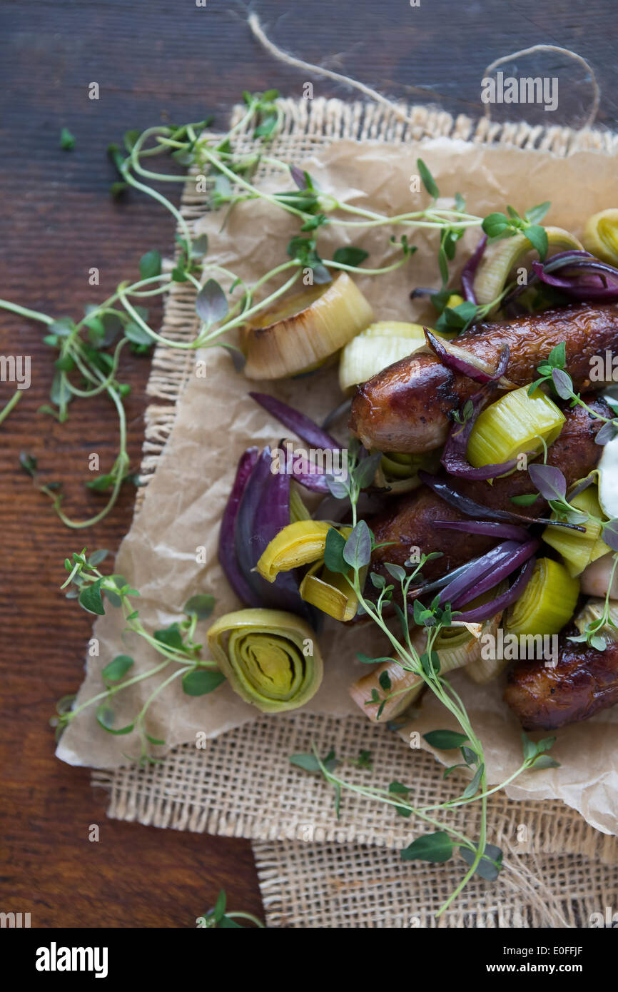 Sausage, Leek, Red Onion & Thyme on Parchment Paper Stock Photo