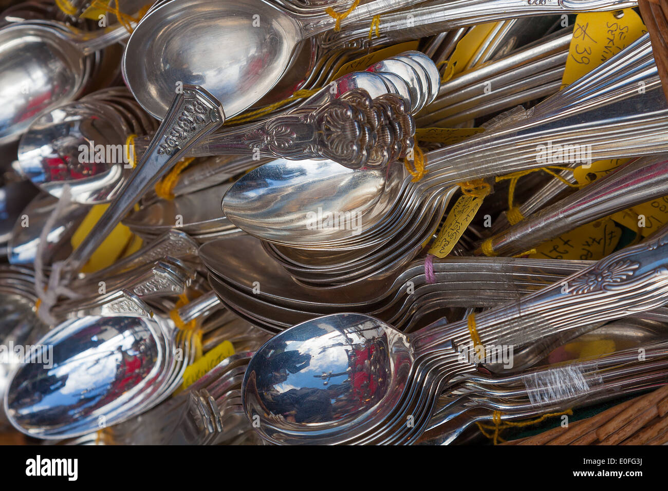 Antique silver spoons for sale on Portobello Road market London Stock Photo