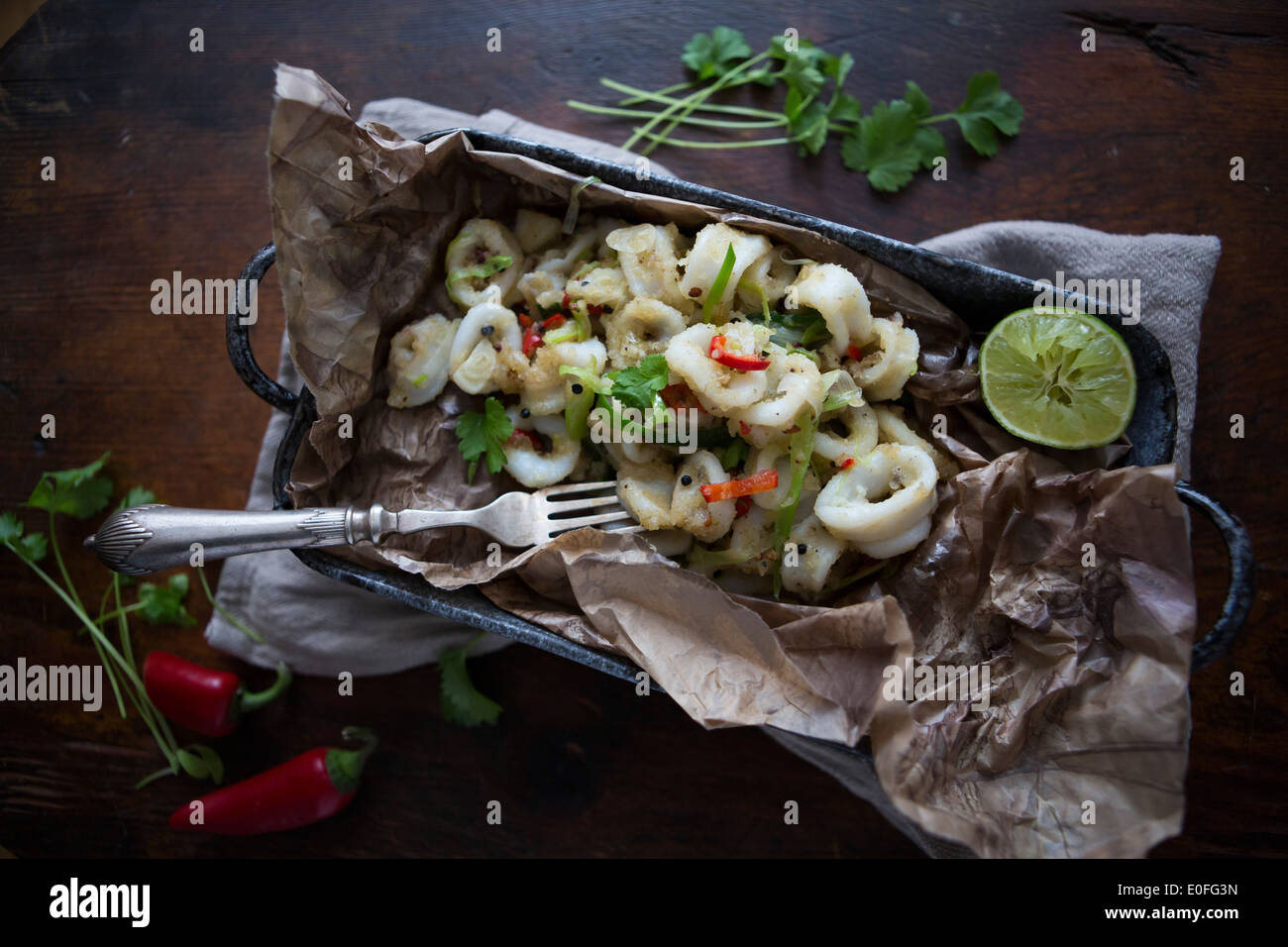 Top View of Salt & Pepper Crispy Squid with Lime and Chilli Stock Photo