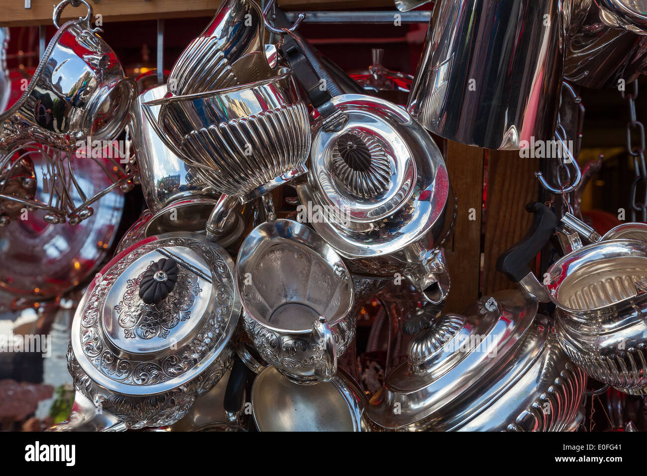 Antique silver tea pots for sale on Portobello Road market London Stock