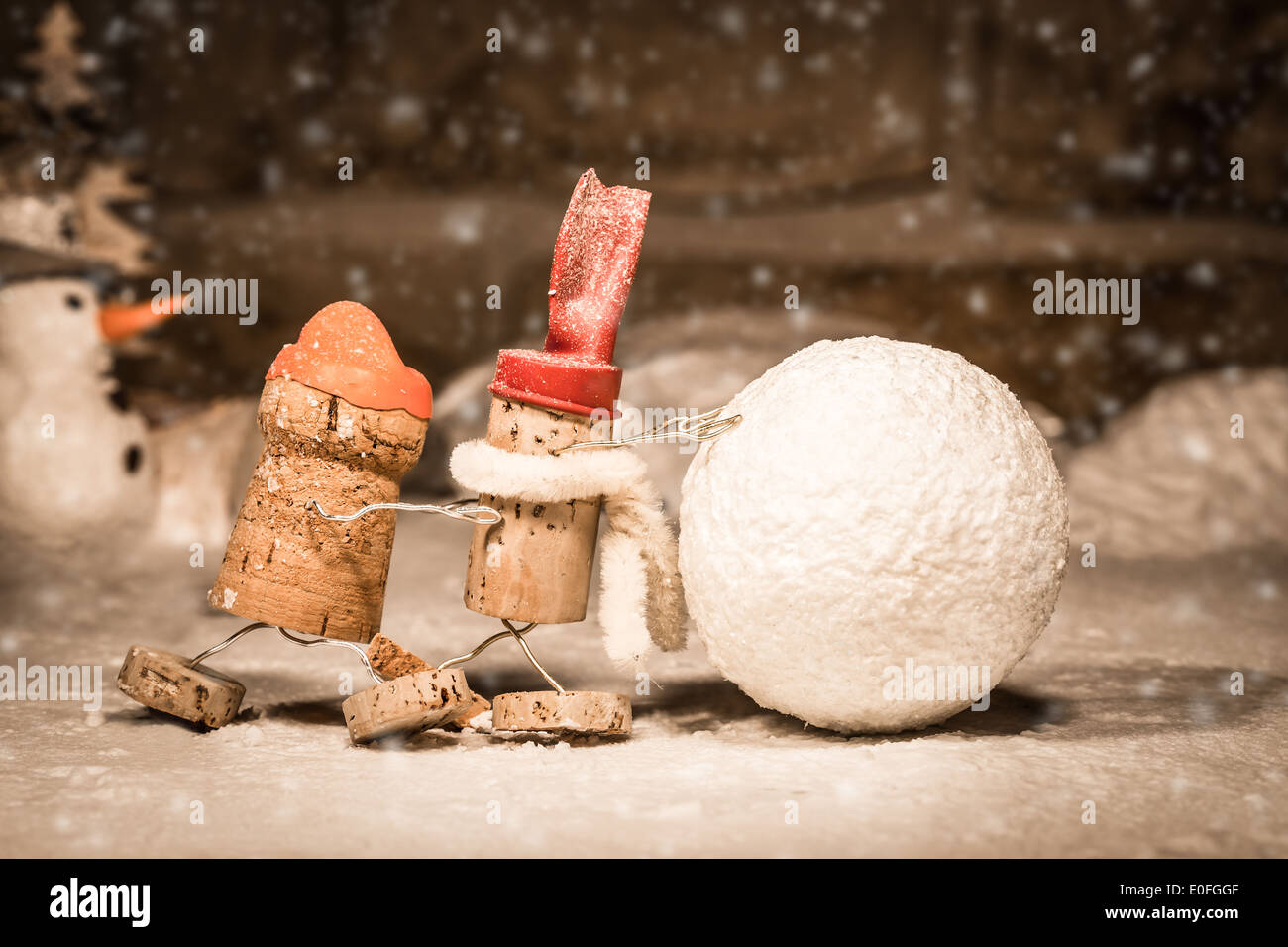 Concept snowball rolling, wine cork figures Stock Photo