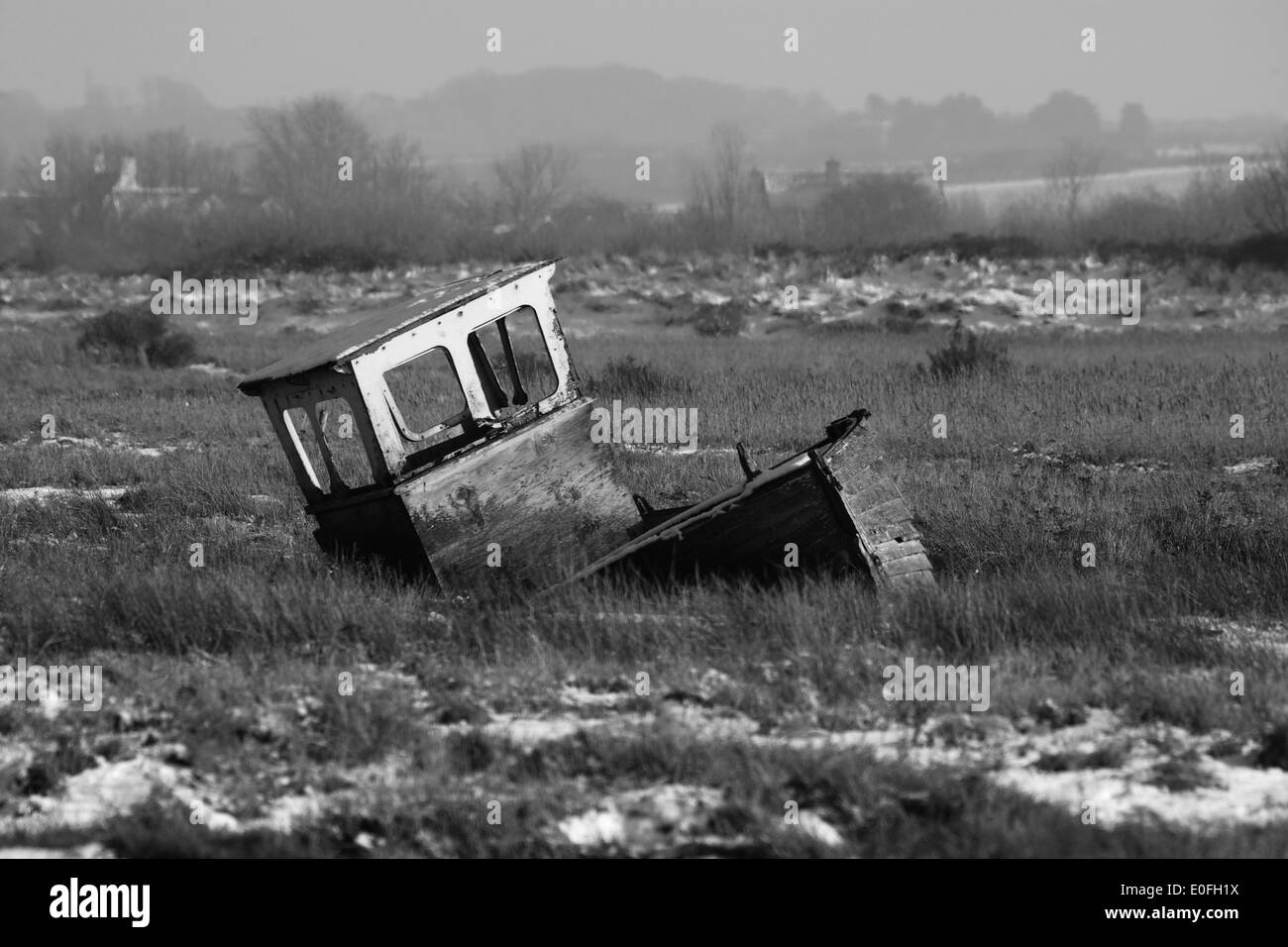 Derelict boat on Thornham marshes, Norfolk Stock Photo