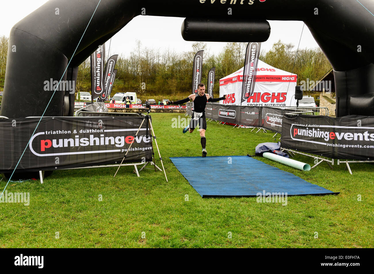 The winner of the Ashbourne Duathlon 2014 crosses the finishing line Stock Photo