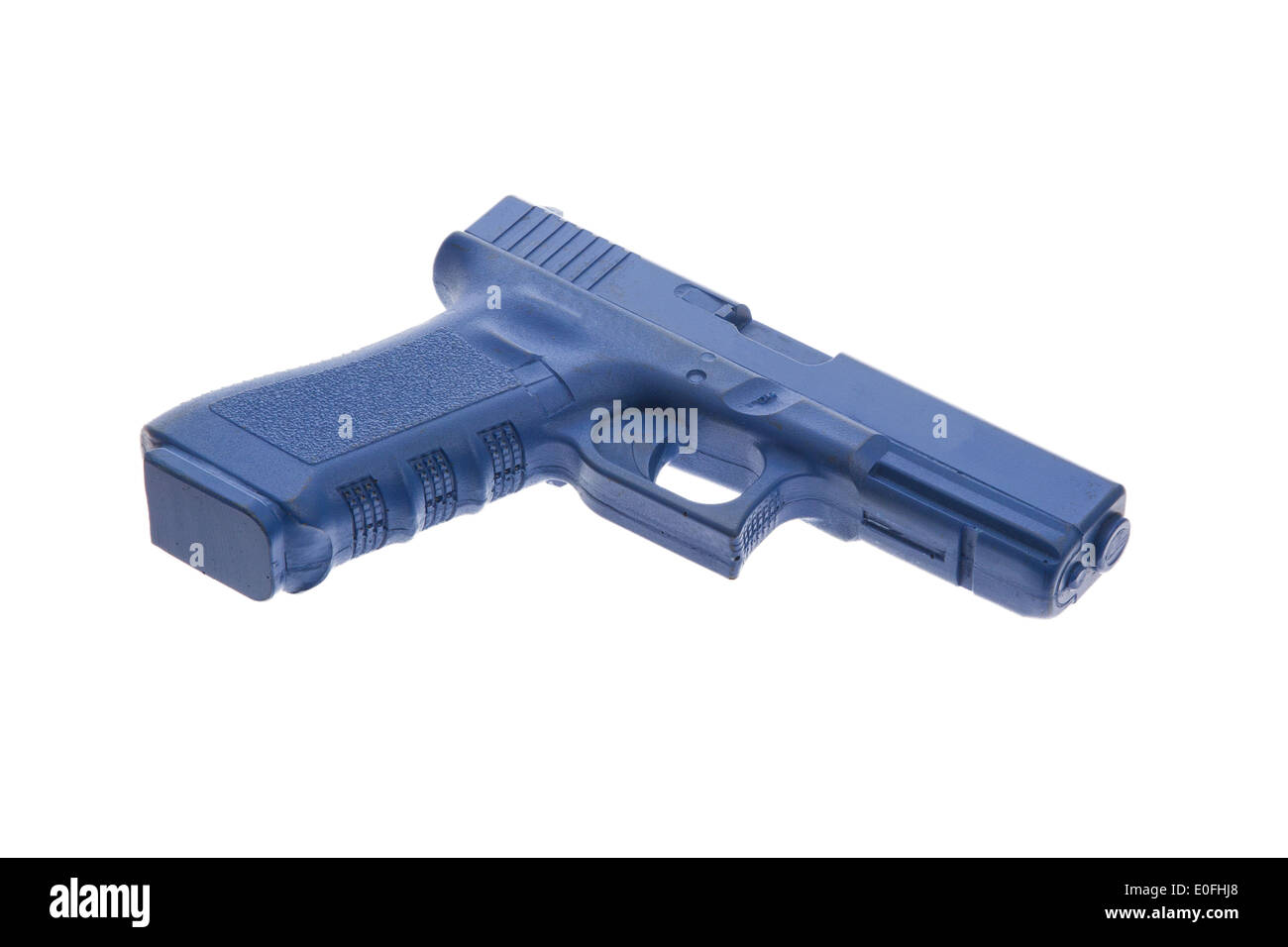 Dirty blue training gun isolated on white, law enforcement Stock Photo