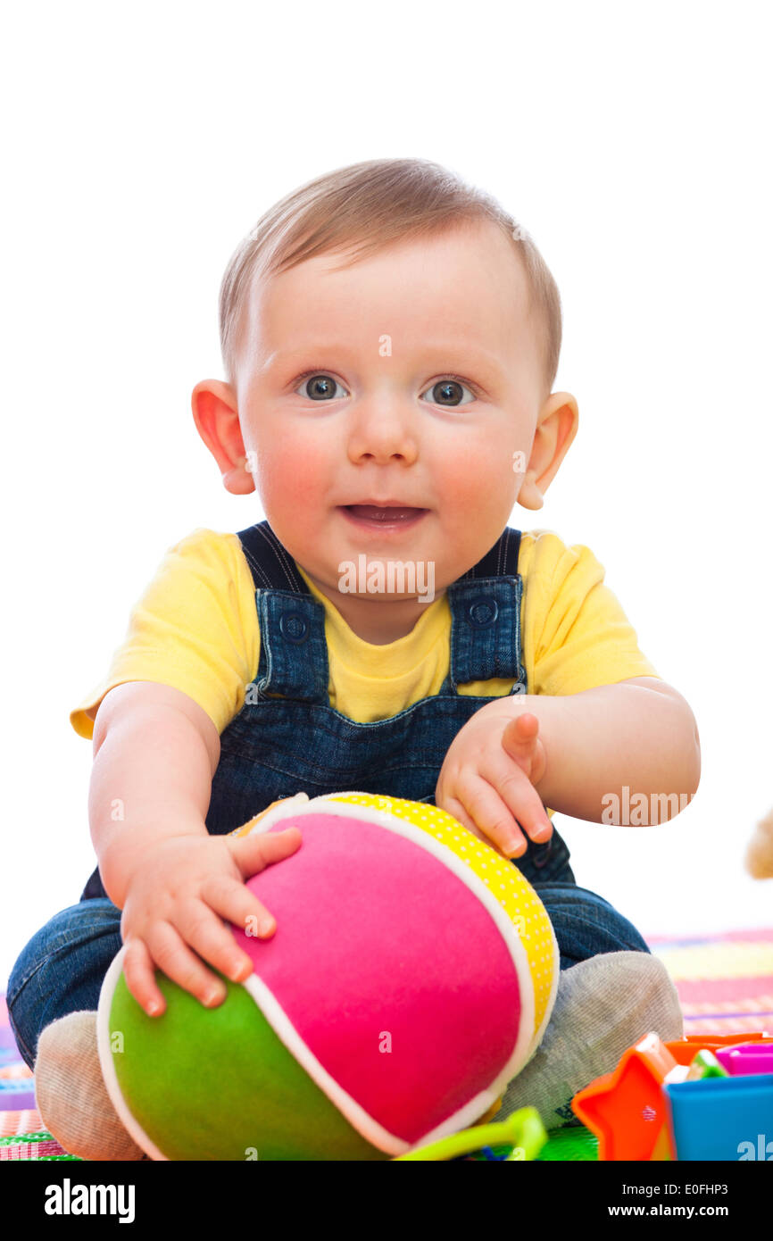 portrait of caucasian bay playing with toy Stock Photo