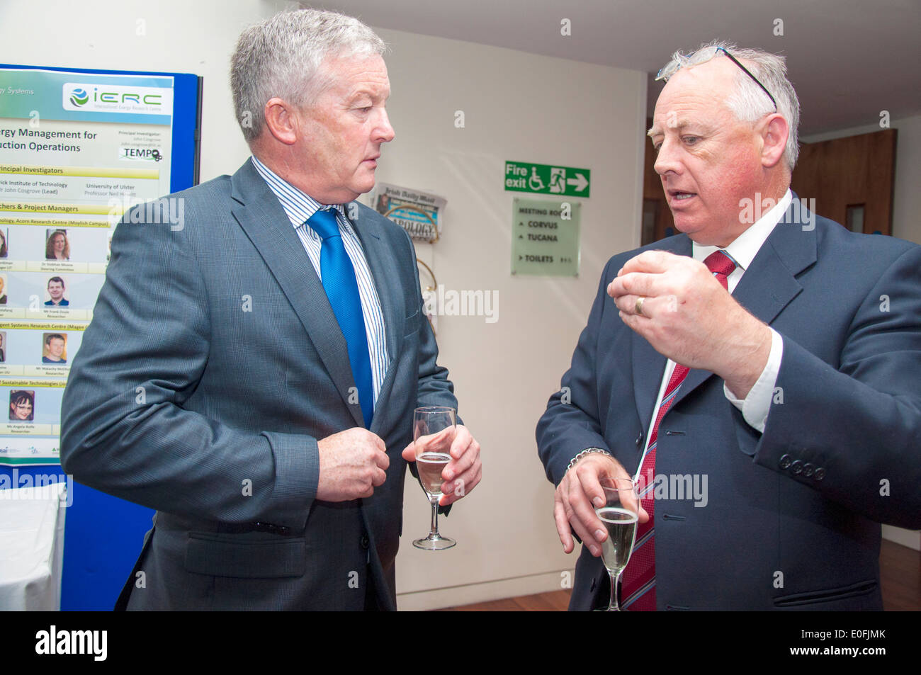 Two men talking networking at a business conference social event Stock Photo