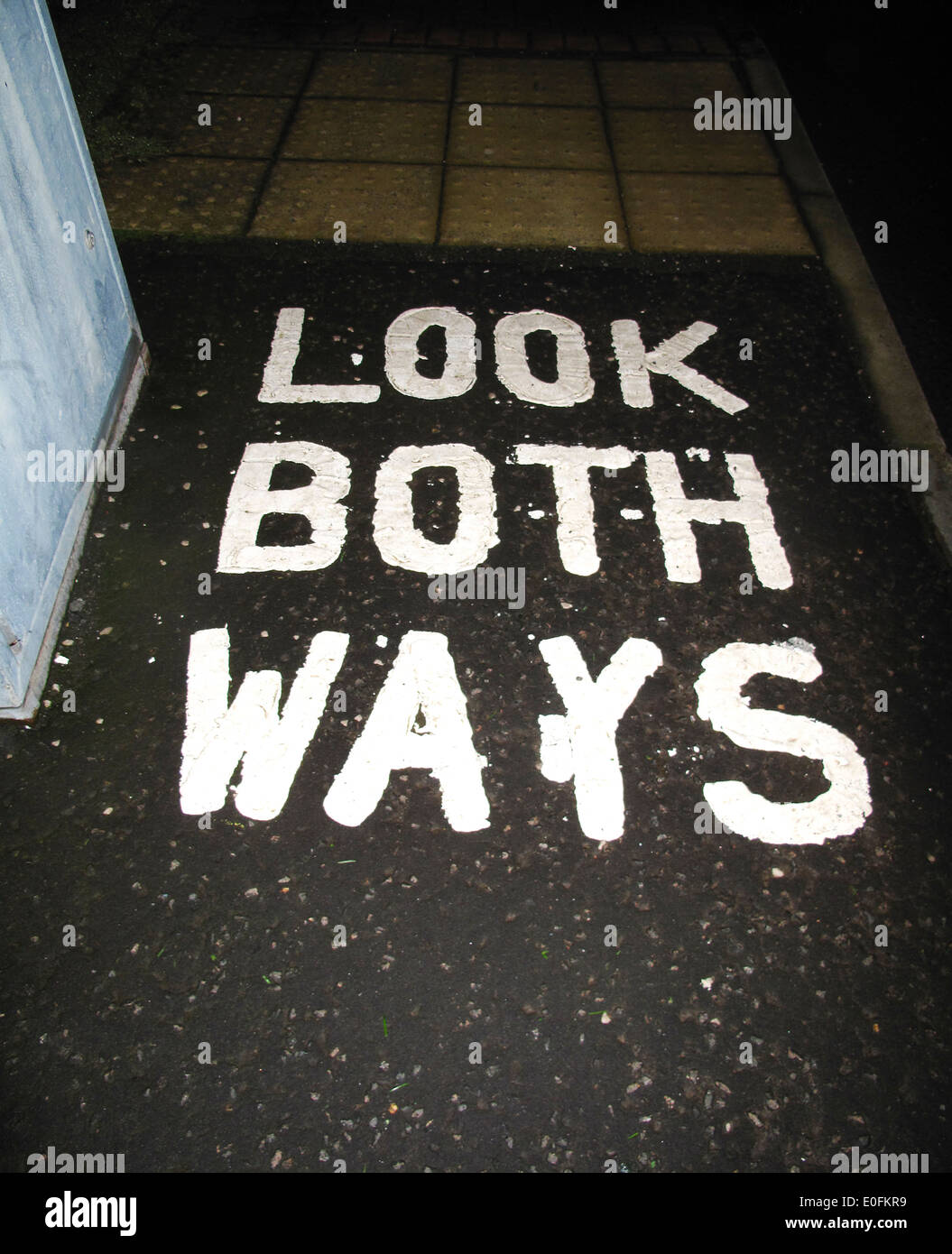 Look both ways lettering on pavement Stock Photo