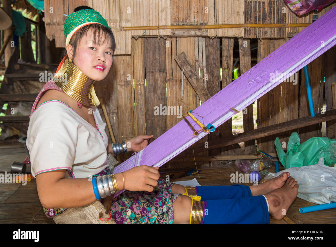 Long-necked woman weaving, Karen tribe, Chiang Mai, Thailand Stock Photo
