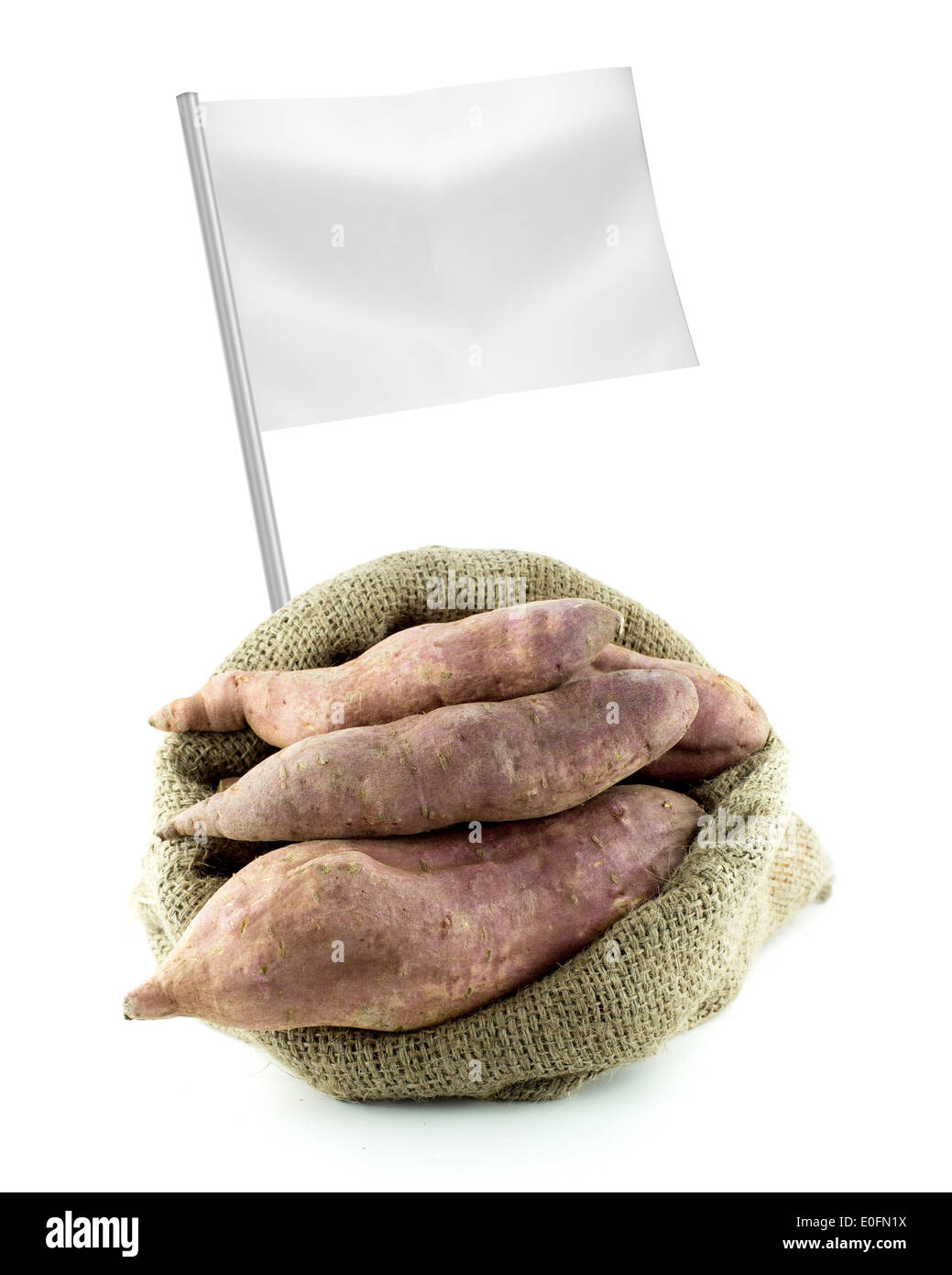 Healthy and organic food concept. Fresh sweet potatoes with flag showing the benefits or the price of fruits. Stock Photo