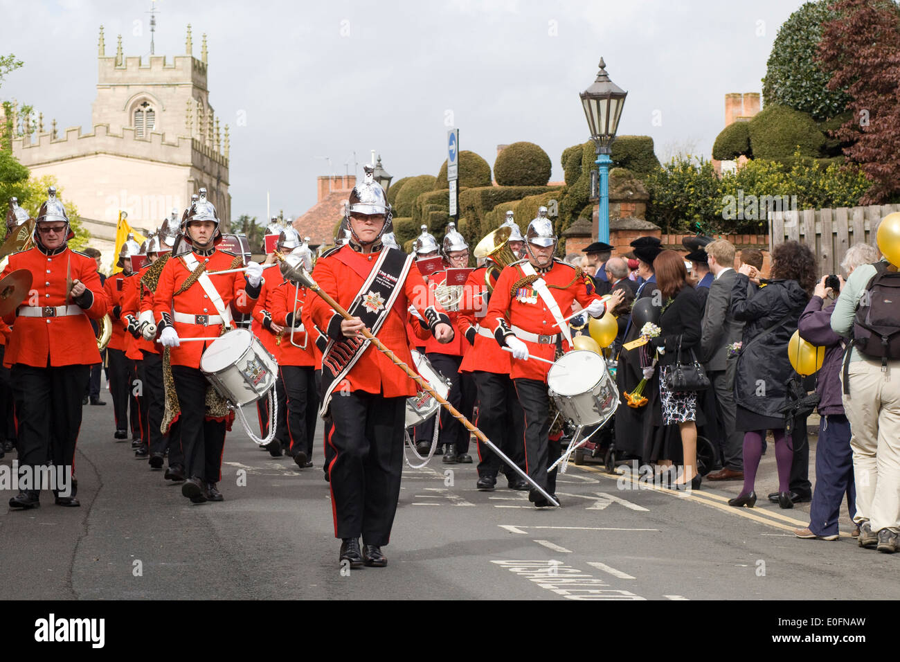 Marching brass band walking down the high street in Stratford upon Avon England Stock Photo