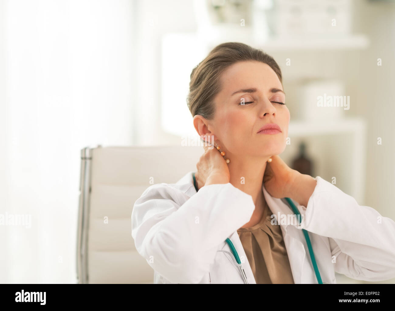 Portrait of tired medical doctor woman in office Stock Photo - Alamy