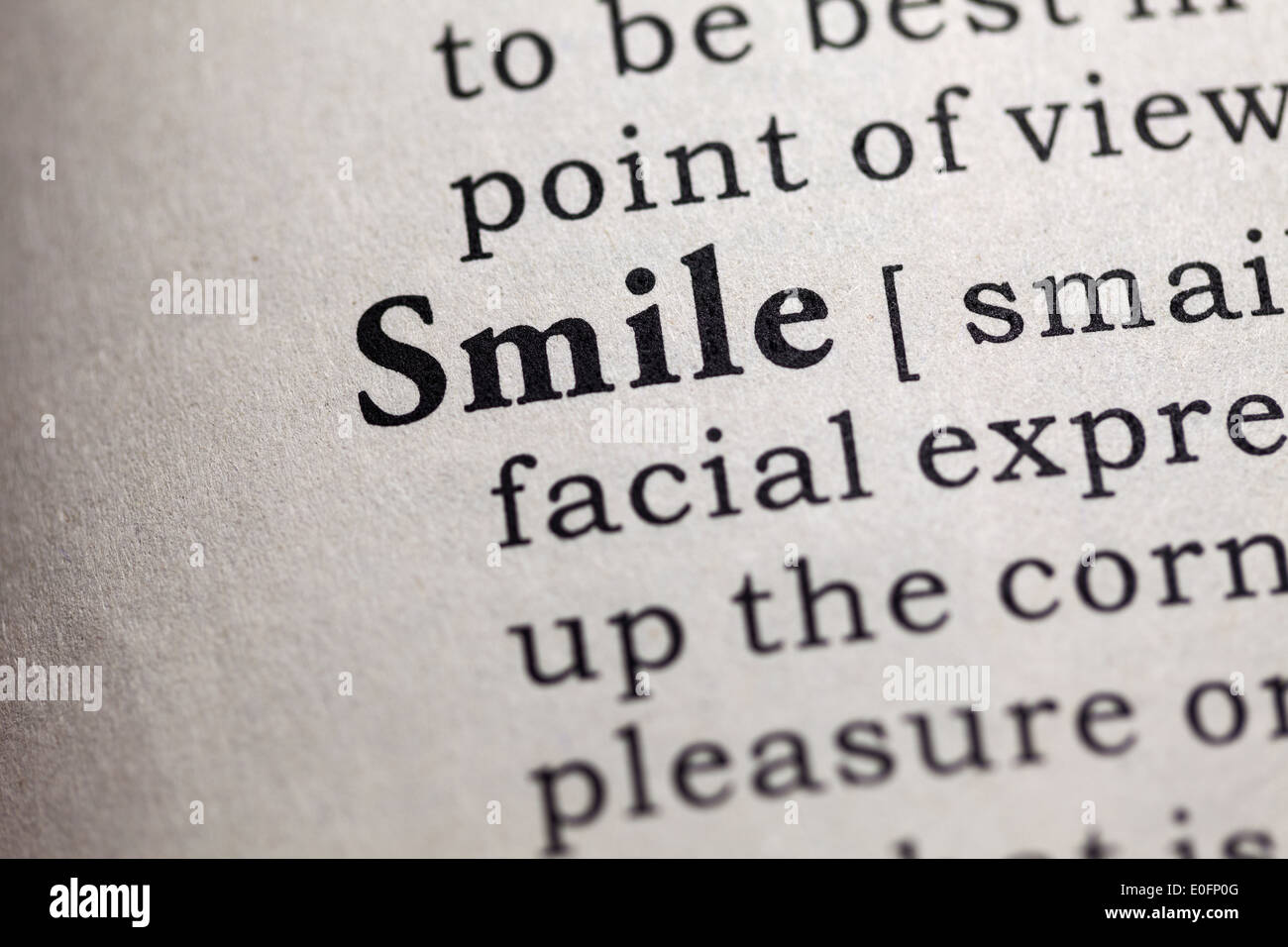 Fake Dictionary, Dictionary definition of the word smile. Stock Photo