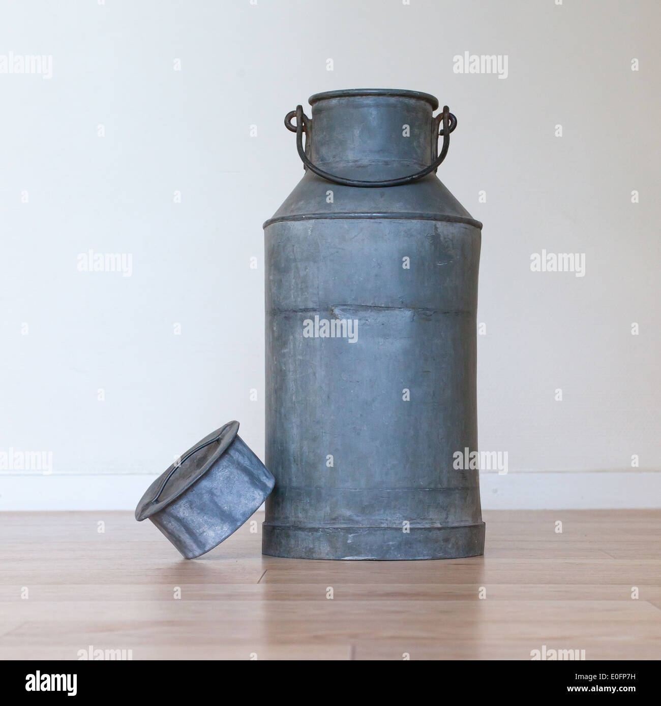 Old metal milk can on white background Stock Photo Alamy