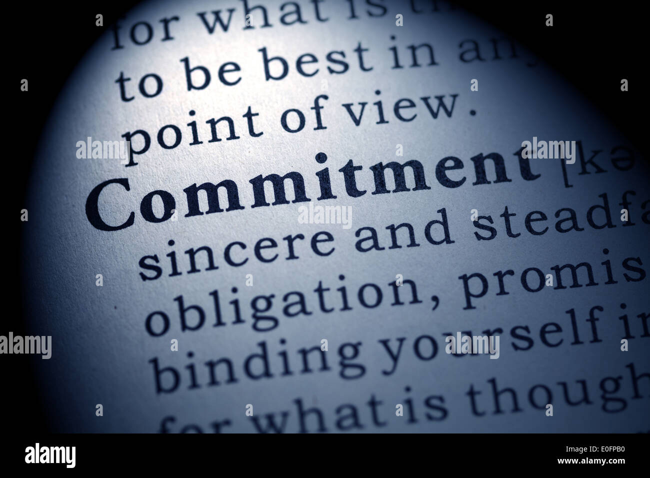 Fake Dictionary, Dictionary definition of the word commitment. Stock Photo
