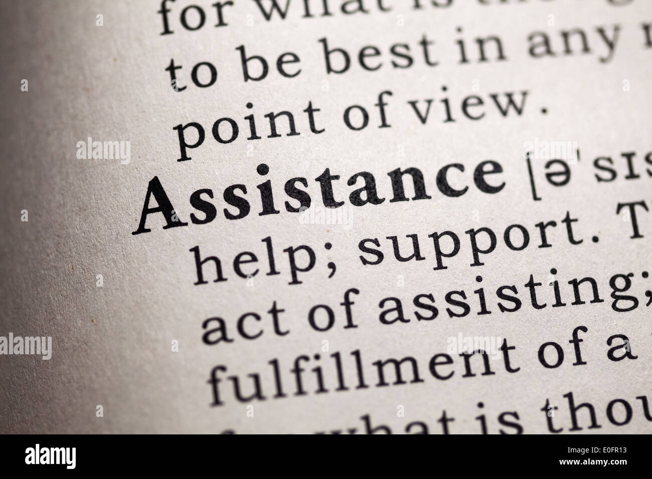 Fake Dictionary, Dictionary definition of the word assistance. Stock Photo