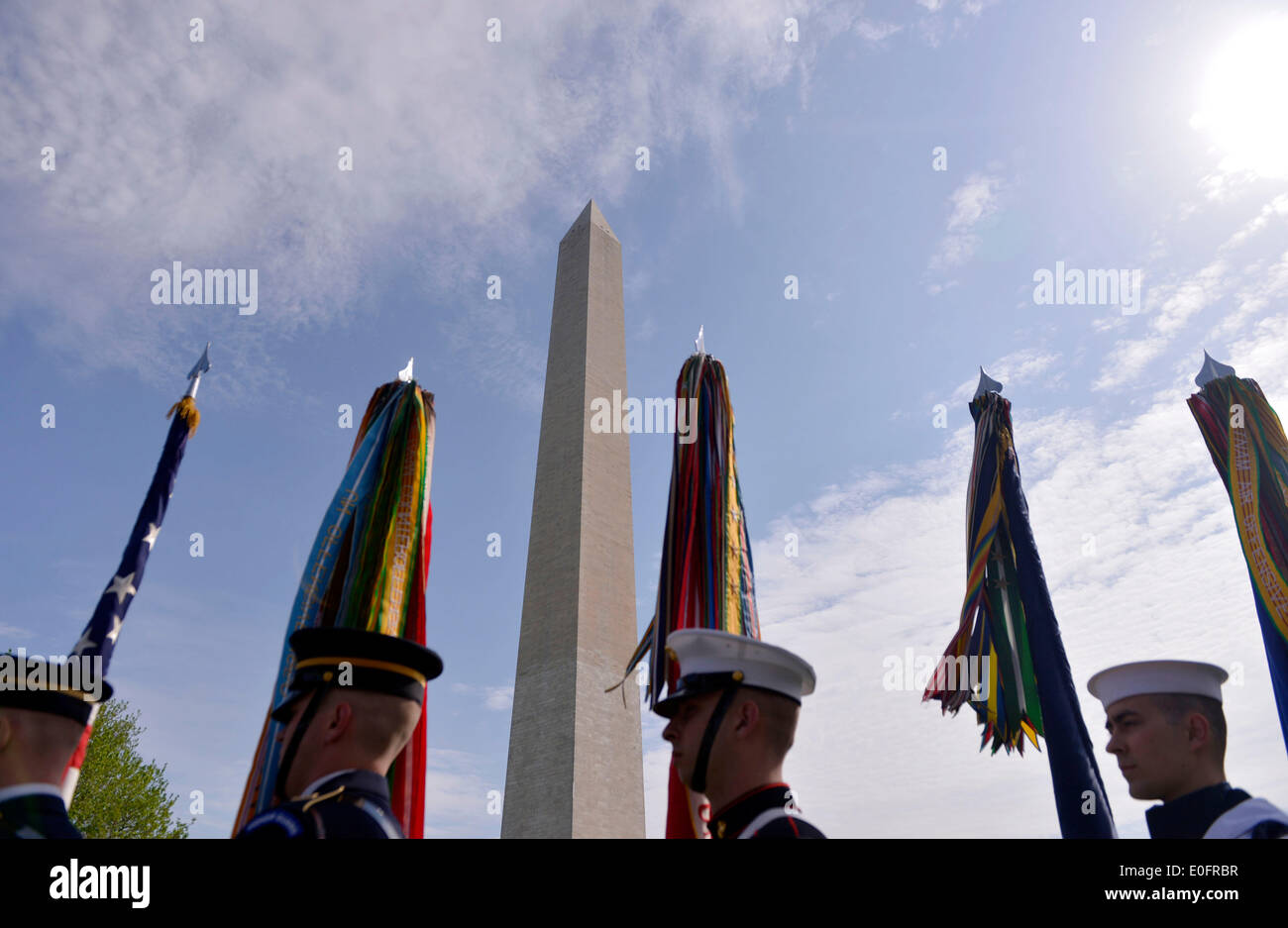Washington, DC, USA. 12th May, 2014. Honor guards stand in front of the Washington Monument during a reopening ceremony, in Washington, DC, the United States, on May 12, 2014. The iconic Washington Monument in this American national capital on Monday reopened on completion of 32-month repairs with a cost of 15 million U.S. dollars. Credit:  Yin Bogu/Xinhua/Alamy Live News Stock Photo
