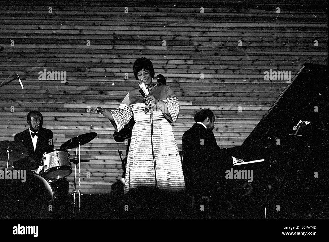 This image captures jazz singer Ella Fitzgerald performing at Nørdhallen in 1969. The performance showcases her iconic vocal talent, one of the most celebrated moments in jazz music history. Stock Photo