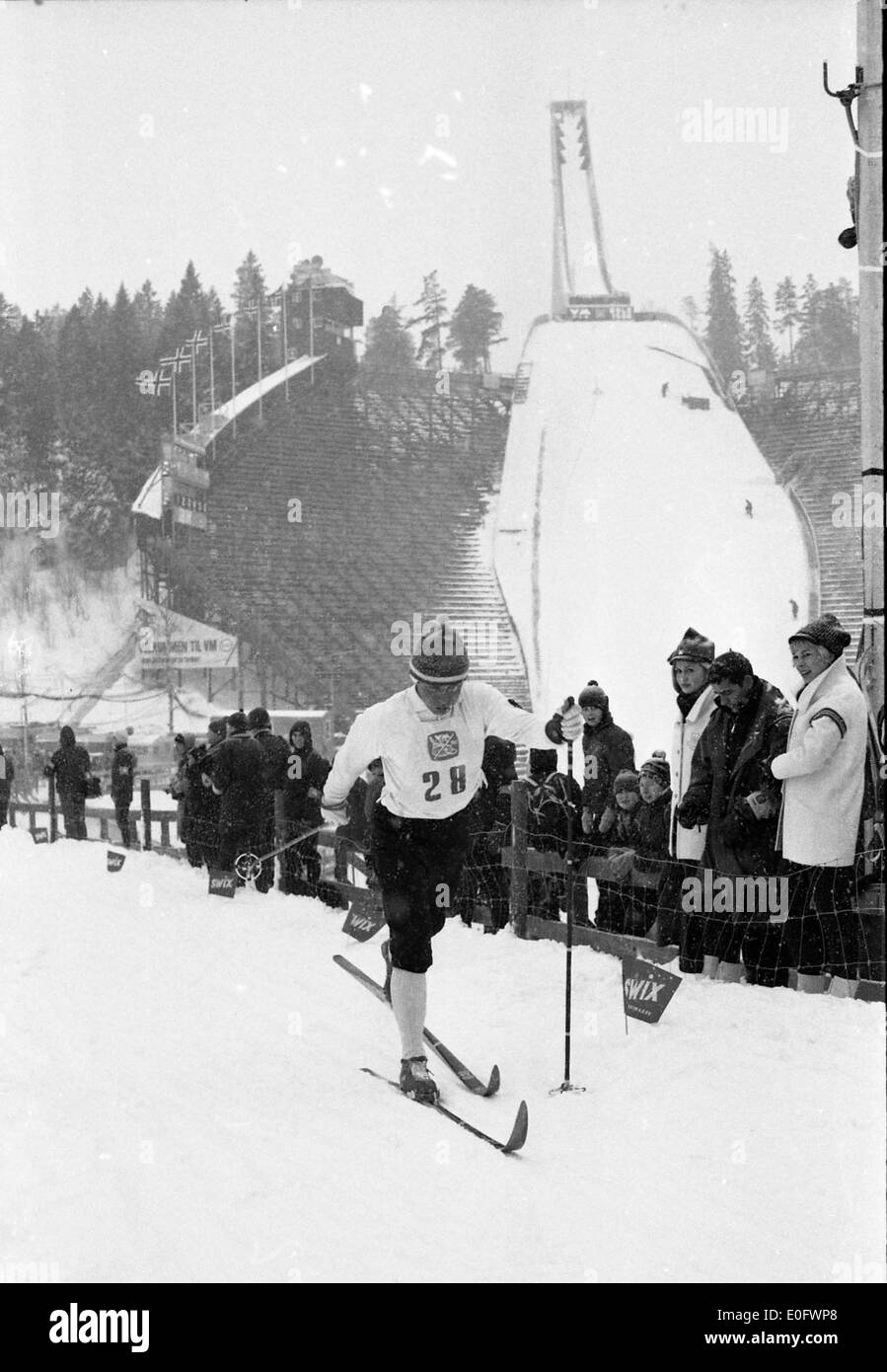 Georg Thoma, the winner of the 15 km combined cross-country ski event at the 1966 World Ski Championships in Oslo. The event highlights Thoma's victory in a key skiing competition held at the Holmenkollen arena. Stock Photo