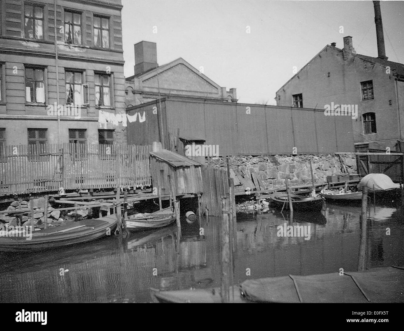 This photograph captures a view of Bredgate Street leading down to the Akerselva River in Oslo, Norway. It highlights the urban landscape and natural environment surrounding this well-known waterway in the city. Stock Photo