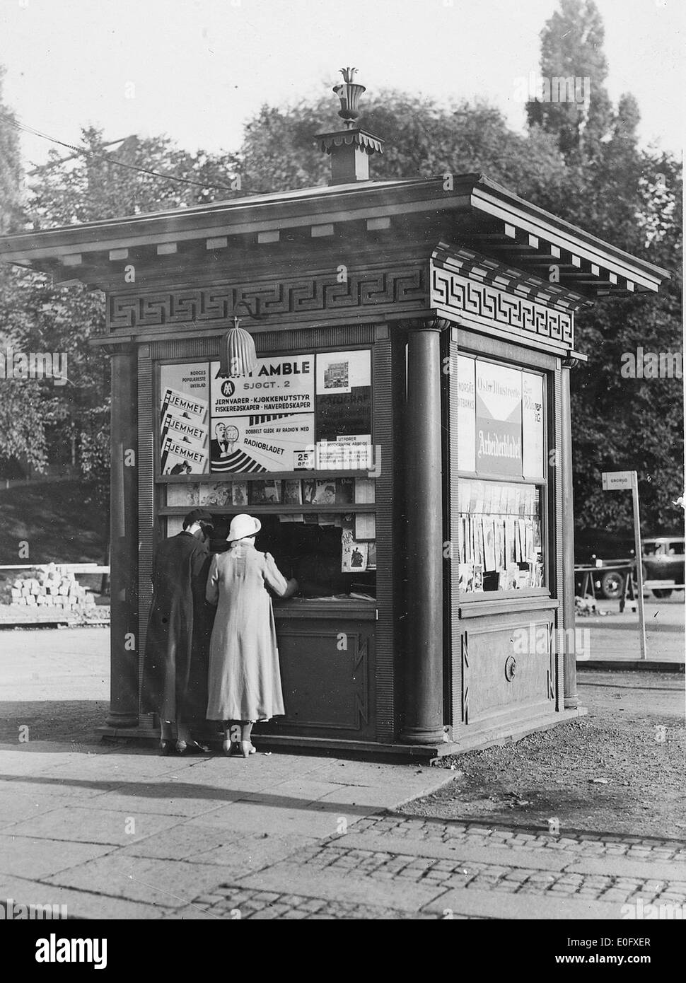 A photograph of the Tyrihanskiosk at St. Hanshaugen, featuring a traditional kiosk and surrounding landscape. This image captures a popular spot in Oslo, Norway, known for its cultural and social significance. Stock Photo