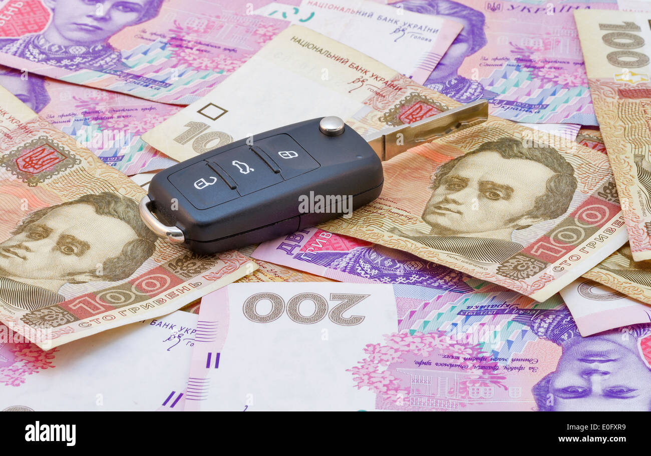 Car keys over the hryvna Ukrainian banknotes Stock Photo