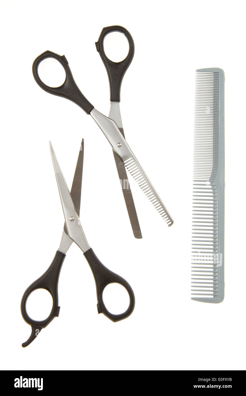 Hair cutting shears and comb isolated on white Stock Photo Alamy