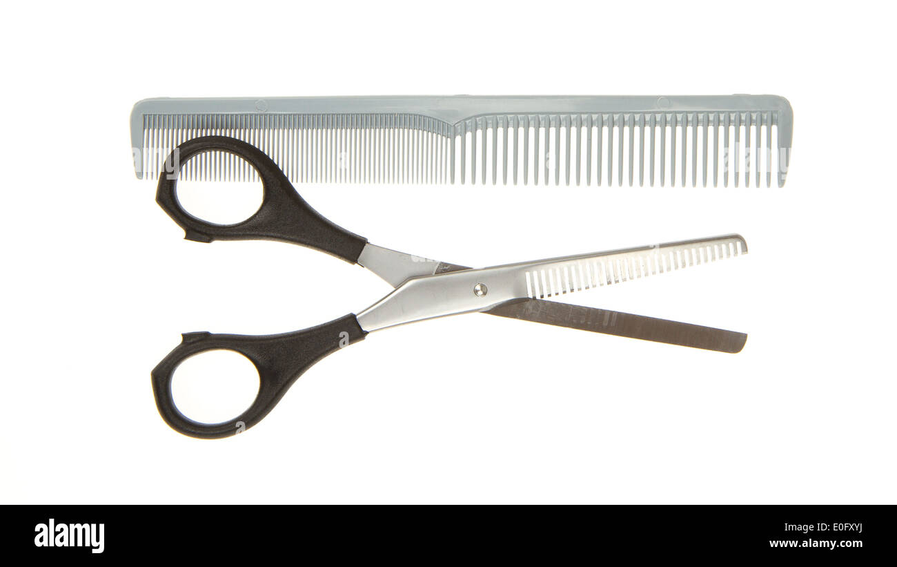 Hair cutting shears and comb isolated on white Stock Photo Alamy