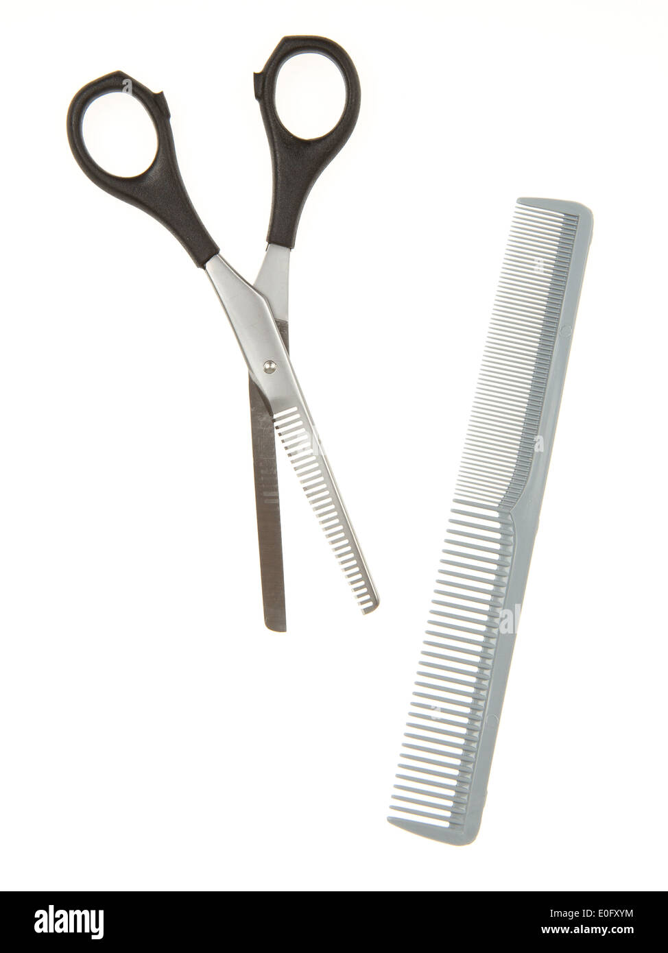 Hair cutting shears and comb isolated on white Stock Photo Alamy