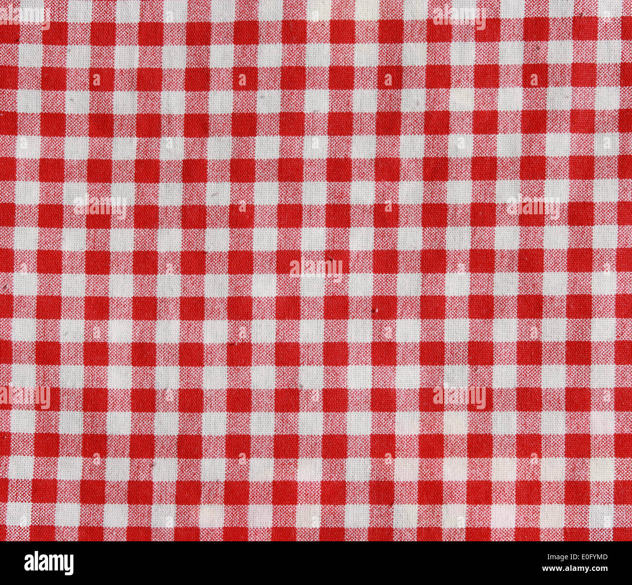 Texture of a red and white checkered picnic blanket. Red linen tablecloth. Stock Photo