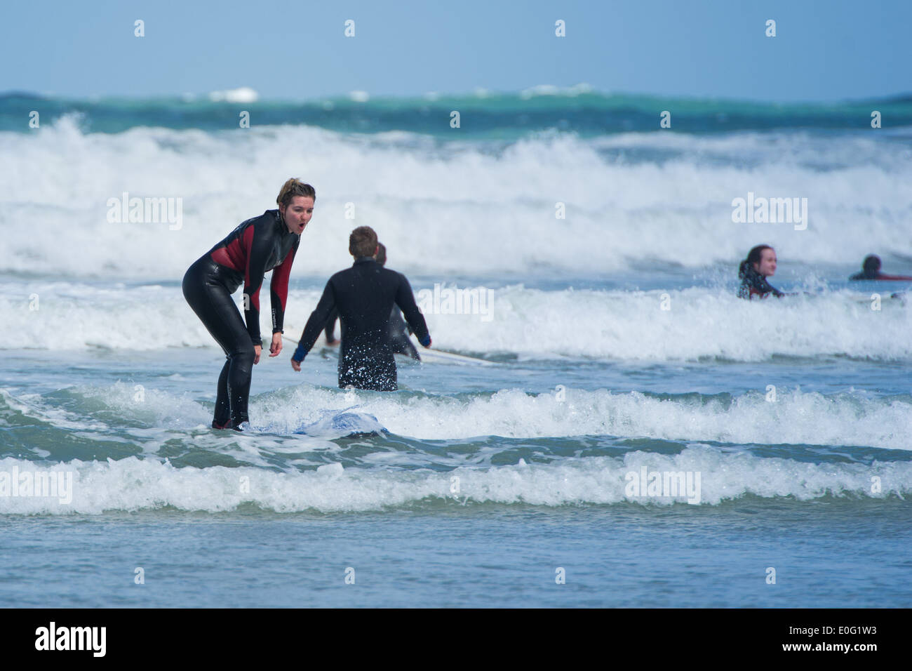 A young female surfer in Newquay, Cornwall, England. Stock Photo