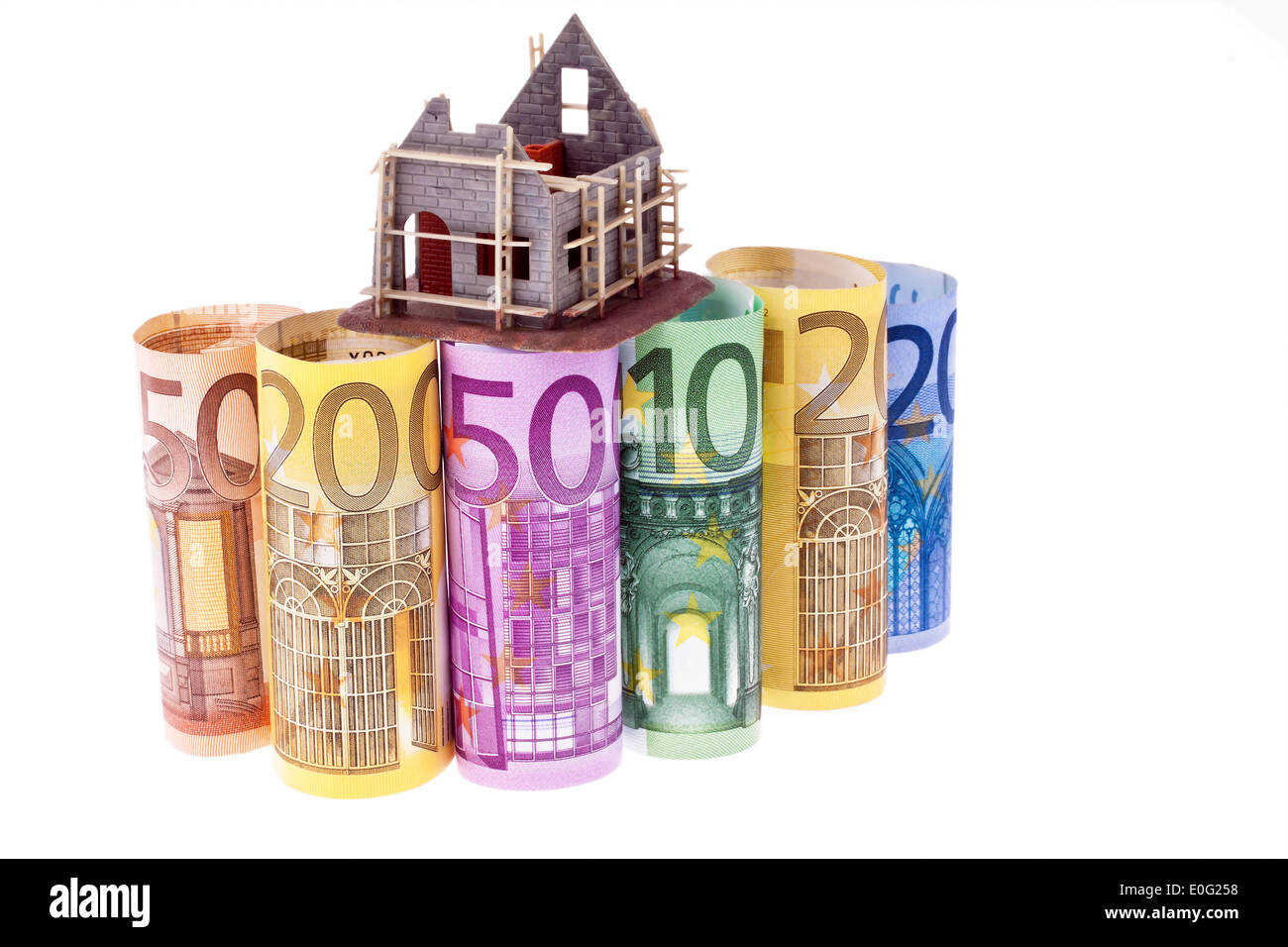 A lot of euro of bank notes with shell house, Viele Euro Geldscheine mit Rohbau Haus Stock Photo