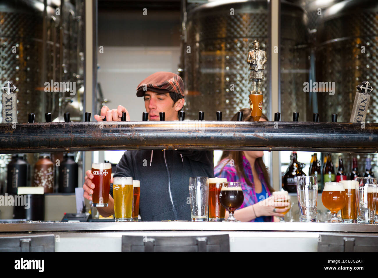 Bend, OR, USA - January 12, 2014: Bartender pouring drinks at Crux Fermentation Project in Bend, Oregon. Stock Photo