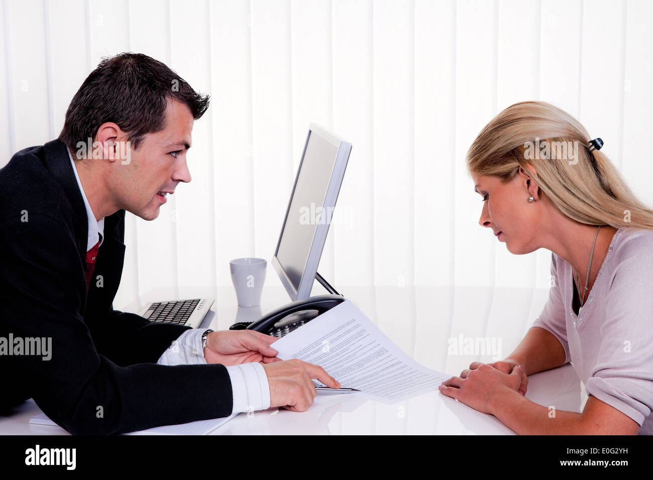 Man and woman with a consultation, Mann und Frau bei einem Beratungsgespraech Stock Photo