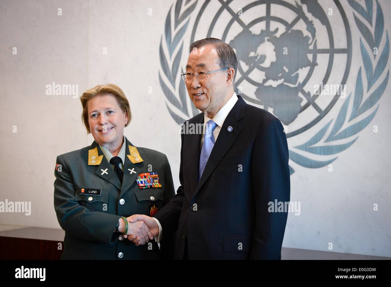 New York, UN headquarters in New York. 12th May, 2014. Major General Kristin Lund (L) shakes hands with United Nations Secretary-General Ban Ki-moon during a photo opportunity after she was appointed as the commander of the UN peacekeeping force in Cyprus, at the UN headquarters in New York, on May 12, 2014. UN chief Ban Ki-moon on Monday named Major General Kristin Lund to take command of the UN peacekeeping force in Cyprus. The Norwegian commander will be the first female to command a UN force. © Niu Xiaolei/Xinhua/Alamy Live News Stock Photo