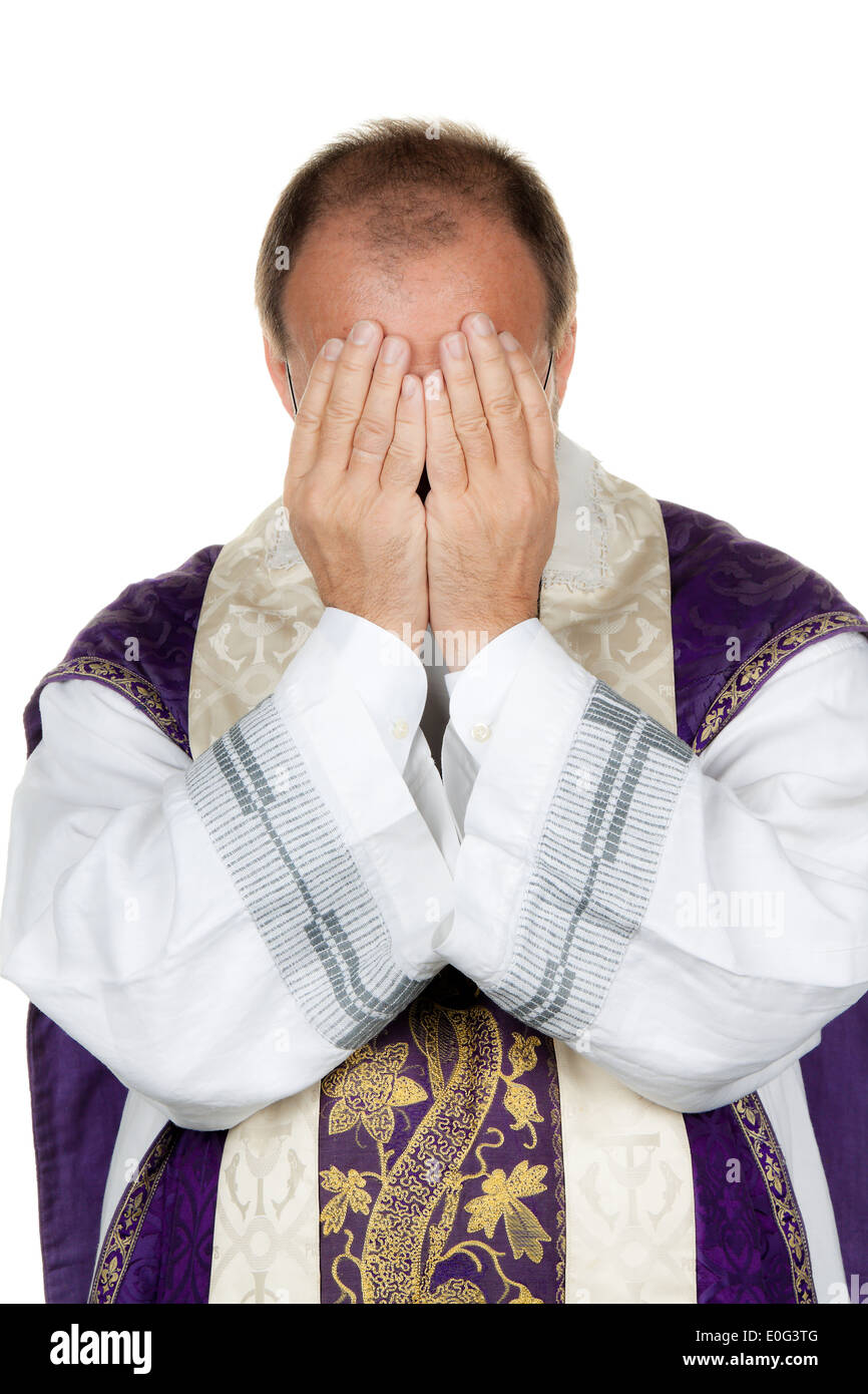 A Catholic priest has despaired, Ein katholischer Priester ist verzweifelt Stock Photo