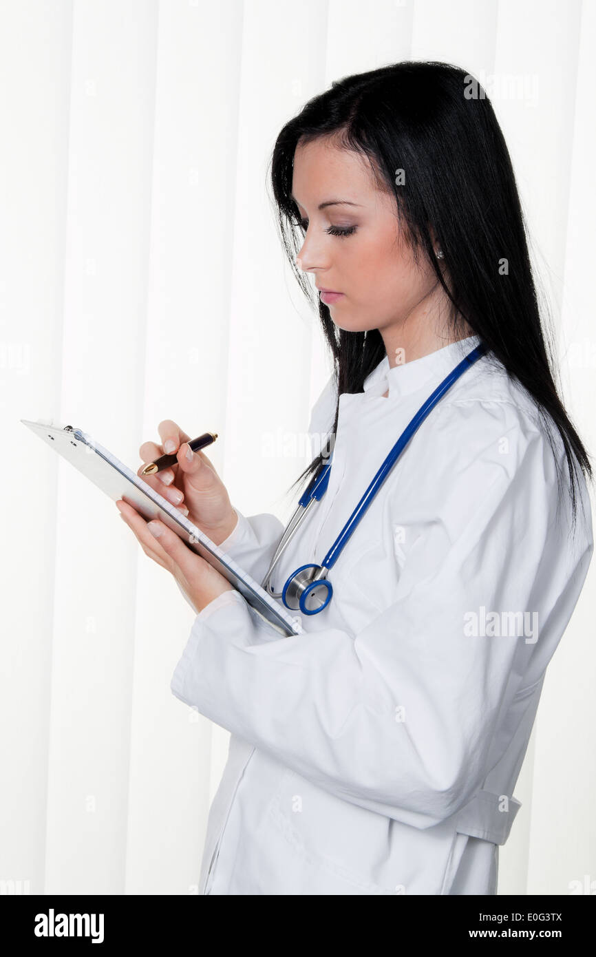 Doctor with diagnosis in the hospital and sick person's act, Arzt bei Diagnose im Krankenhaus und Krankenakt Stock Photo