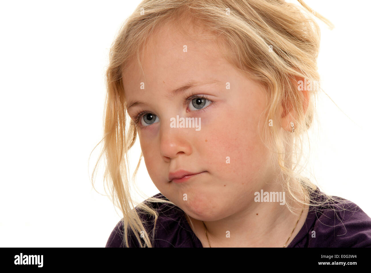 Child head. Portrait of a small sad girl., Kinderkopf. Portrait eines kleinen traurigen Maedchens. Stock Photo