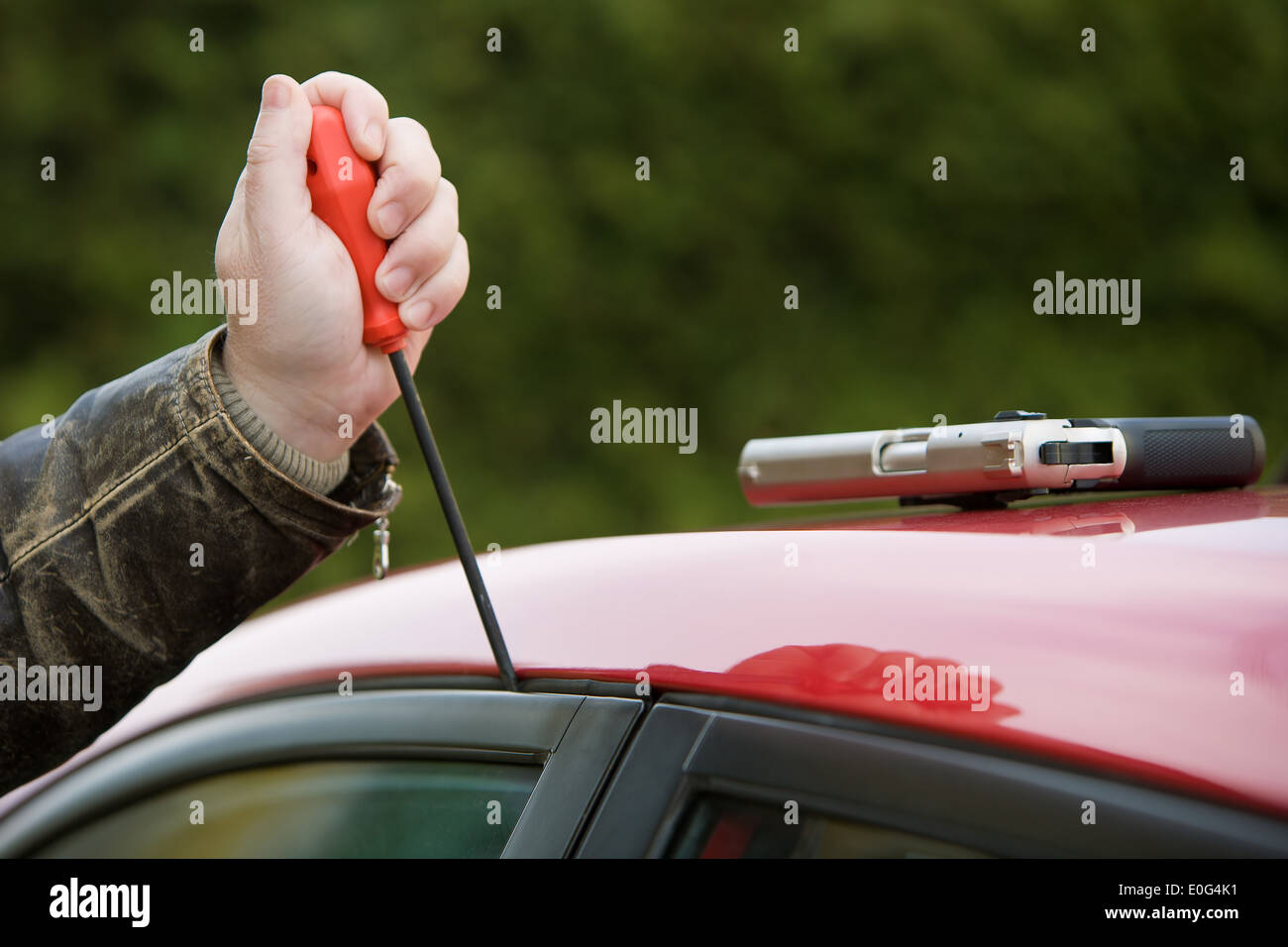 Burglar at a car carbreaker burglary Stock Photo
