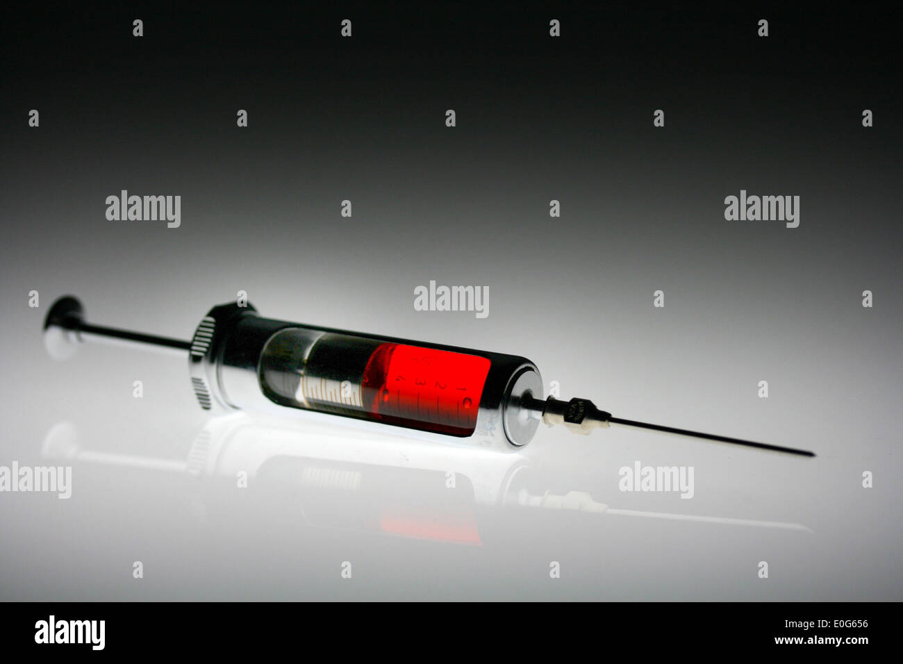 Syringe with red liquid Stock Photo