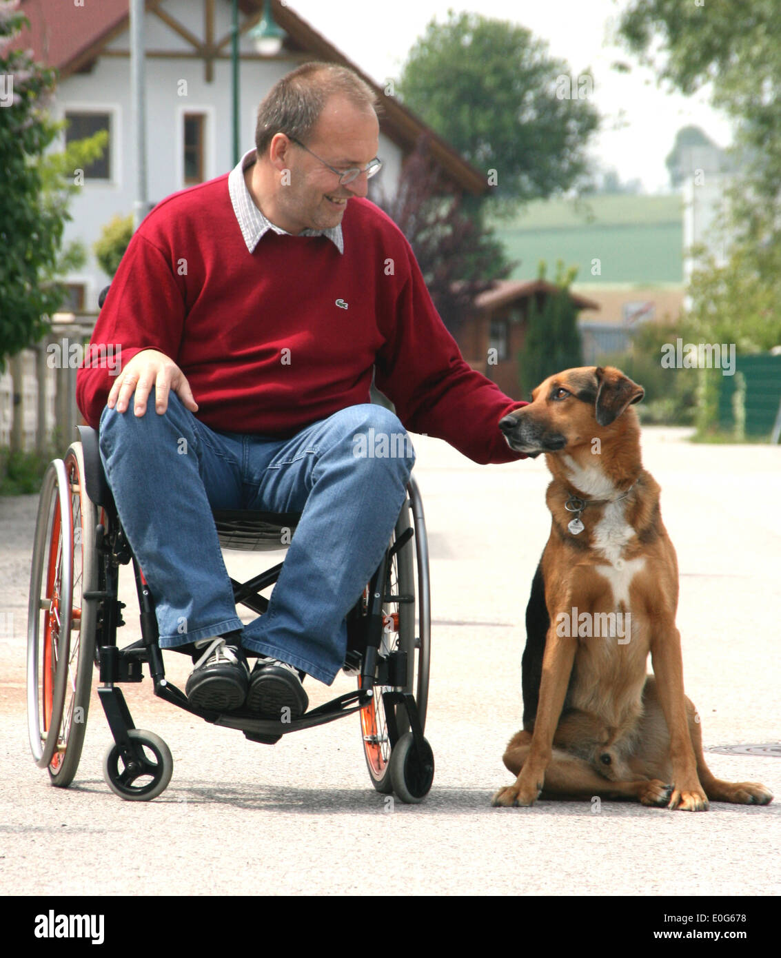 Man in the wheel chair with dog - one in a wheelchair with dog [], barrier, barriers, Hindering, suitable for the handicapped, s Stock Photo