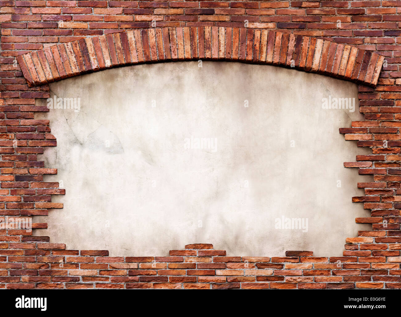 Stucco background framed with old red brick wall with an arch. Isolated with clipping path. Stock Photo