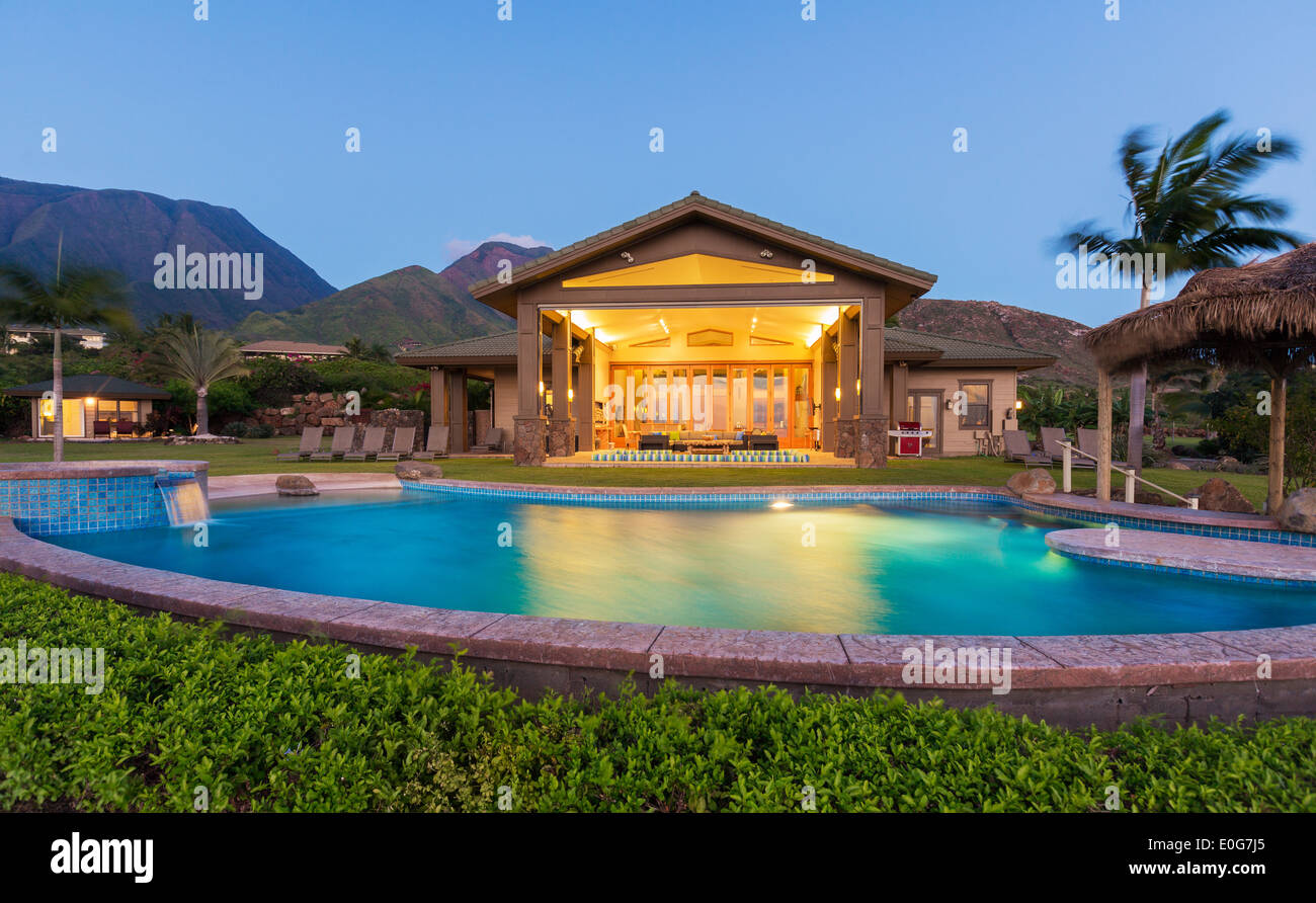 Luxury home with swimming pool at sunset Stock Photo