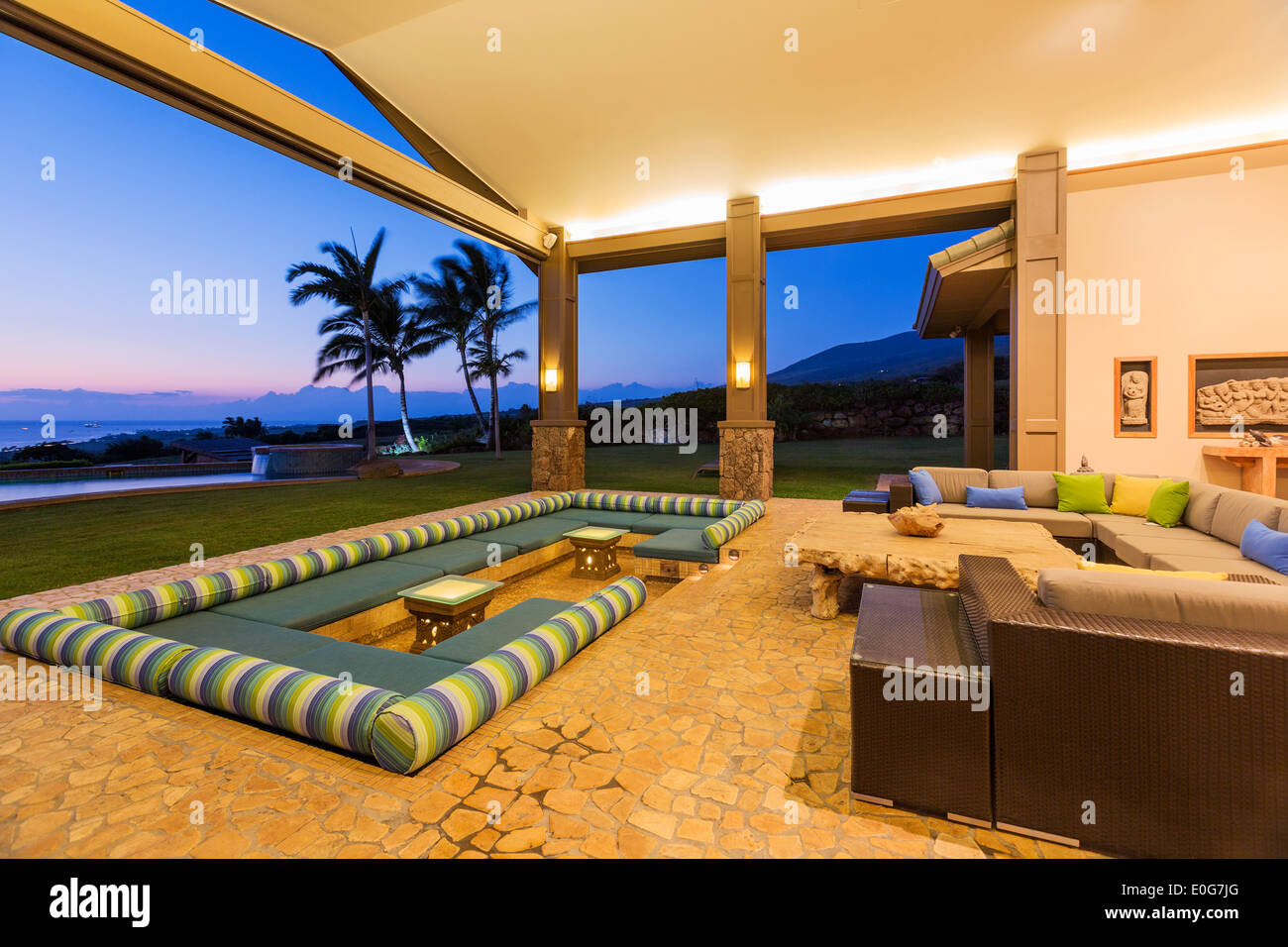 Beautiful Luxury Home, Exterior Patio Lounge at Sunset Stock Photo