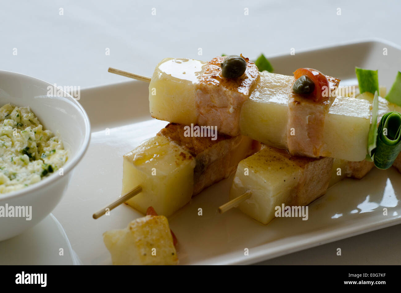 Skewered Potato and Ham, grilled and served with a sweet and piquant sauce Stock Photo Alamy