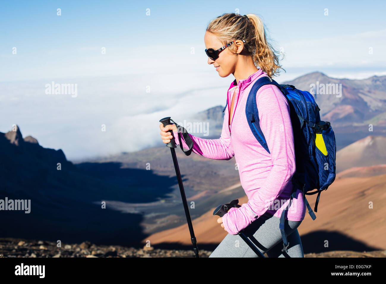 Woman hiking on beautiful mountain trail. Trekking and backpacking in the mountains. Healthy lifestyle outdoor adventure concept Stock Photo